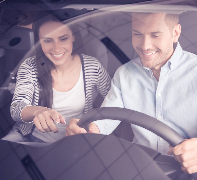 Couple driving a car